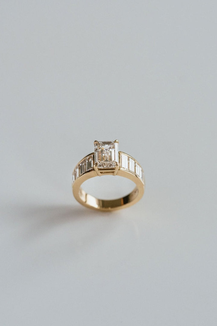Emerald Cut Diamond With Graduated Baguette Channel Set Accents