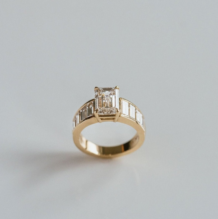 Emerald Cut Diamond With Graduated Baguette Channel Set Accents