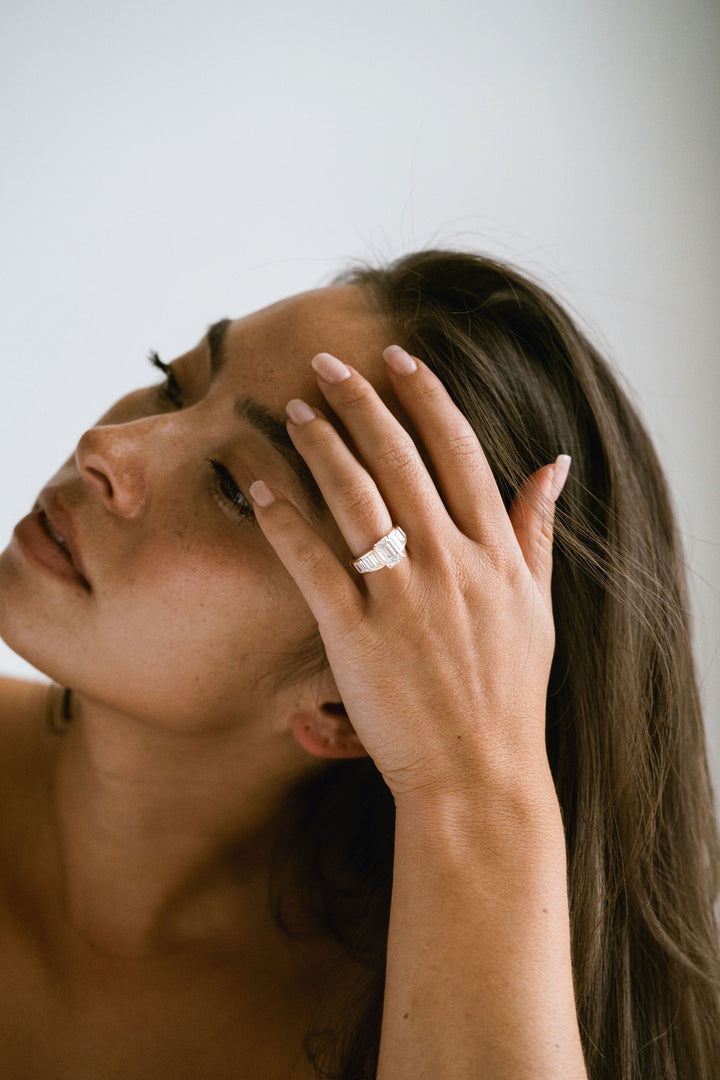 Emerald Cut Diamond With Graduated Baguette Channel Set Accents