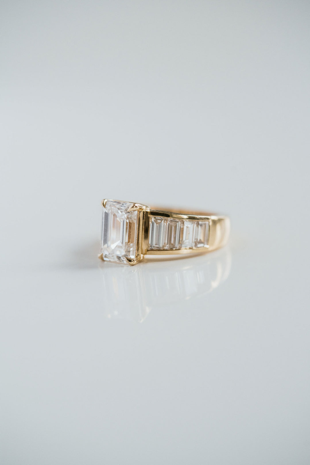Emerald Cut Diamond With Graduated Baguette Channel Set Accents
