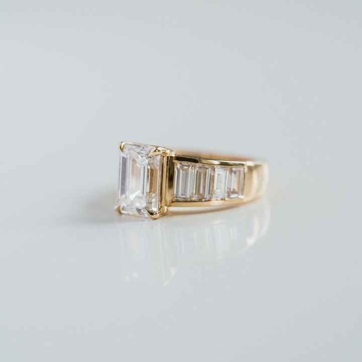 Emerald Cut Diamond With Graduated Baguette Channel Set Accents