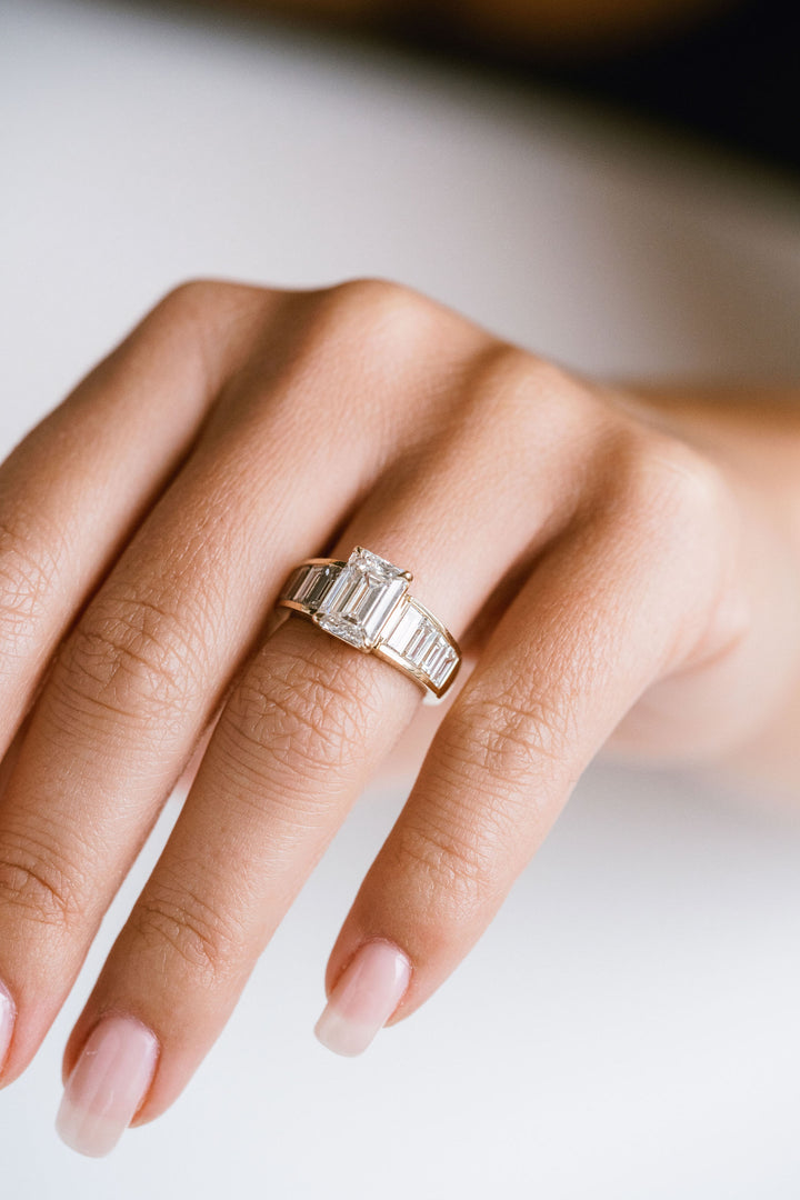 Emerald Cut Diamond With Graduated Baguette Channel Set Accents
