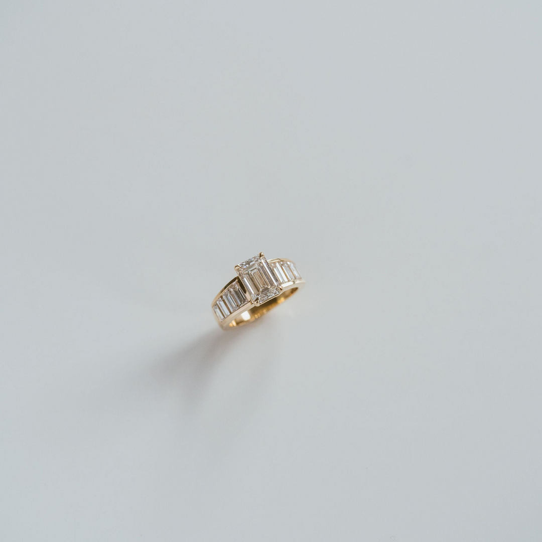 Emerald Cut Diamond With Graduated Baguette Channel Set Accents
