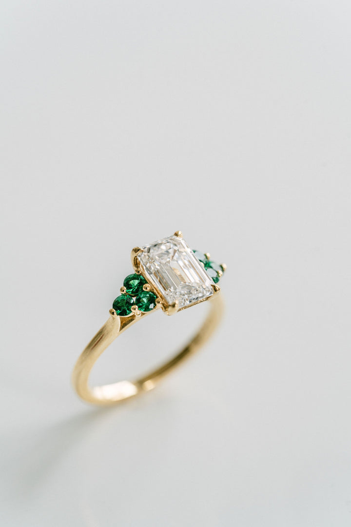 Emerald Cut Diamond With Emerald Cluster Accents