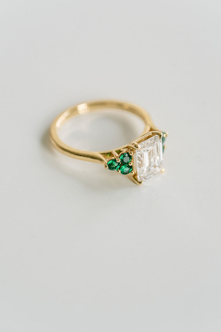 Emerald Cut Diamond With Emerald Cluster Accents
