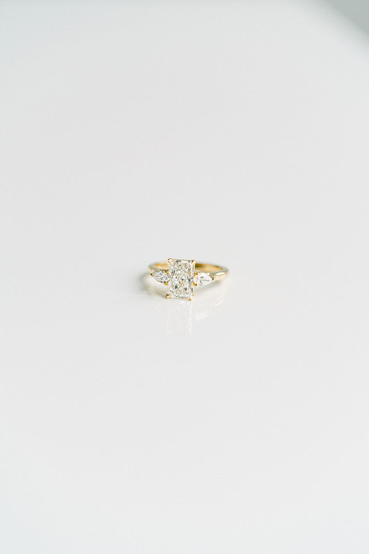 Radiant Cut Diamond Engagement Ring With Pear Shape Accents, 14k Yellow Gold
