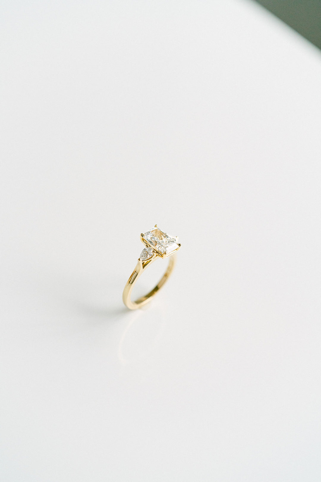 Radiant Cut Diamond Engagement Ring With Pear Shape Accents, 14k Yellow Gold