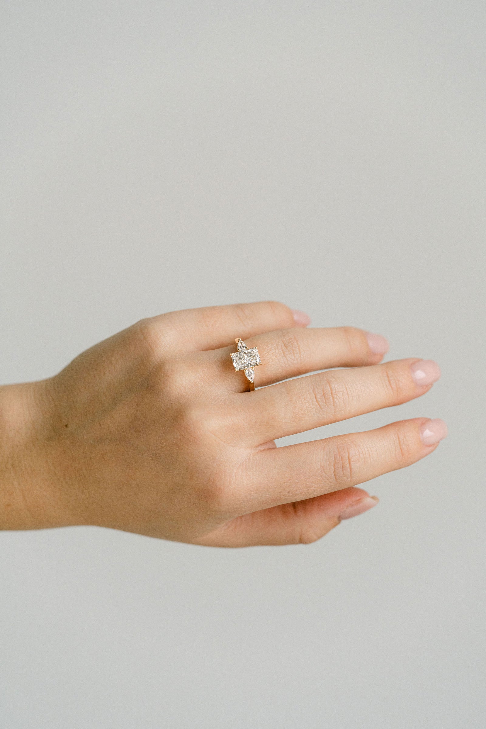 Radiant Cut Diamond Engagement Ring With Pear Shape Accents, 14k Yellow Gold