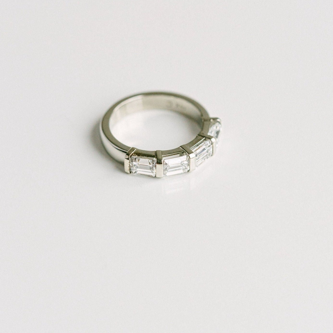 East-West Set Emerald Cut Diamond Band