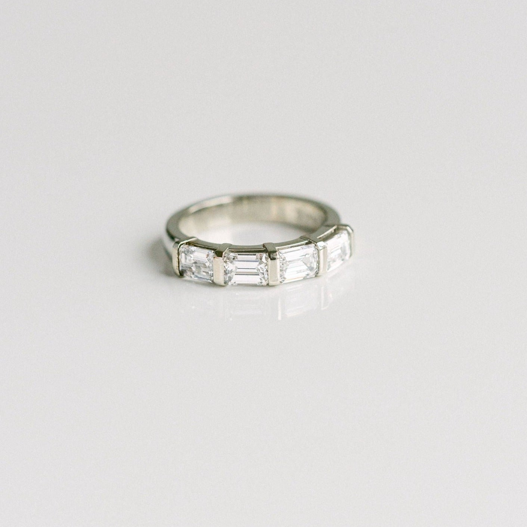 East-West Set Emerald Cut Diamond Band