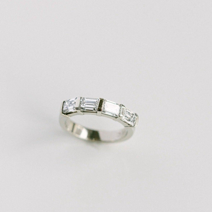 East-West Set Emerald Cut Diamond Band
