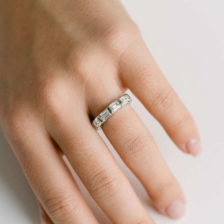 East-West Set Emerald Cut Diamond Band
