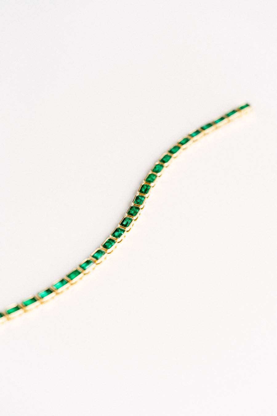 7.50ctw Emerald Cut Colombian Emerald Bezel Tennis Bracelet, 14k Yellow Gold