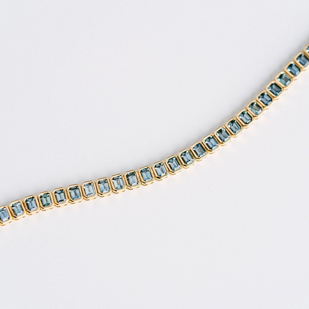 Emerald Cut Blue-Green Sapphire Bezel Tennis Bracelet