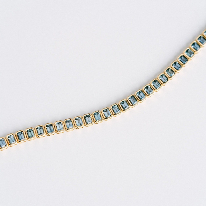 Emerald Cut Blue-Green Sapphire Bezel Tennis Bracelet