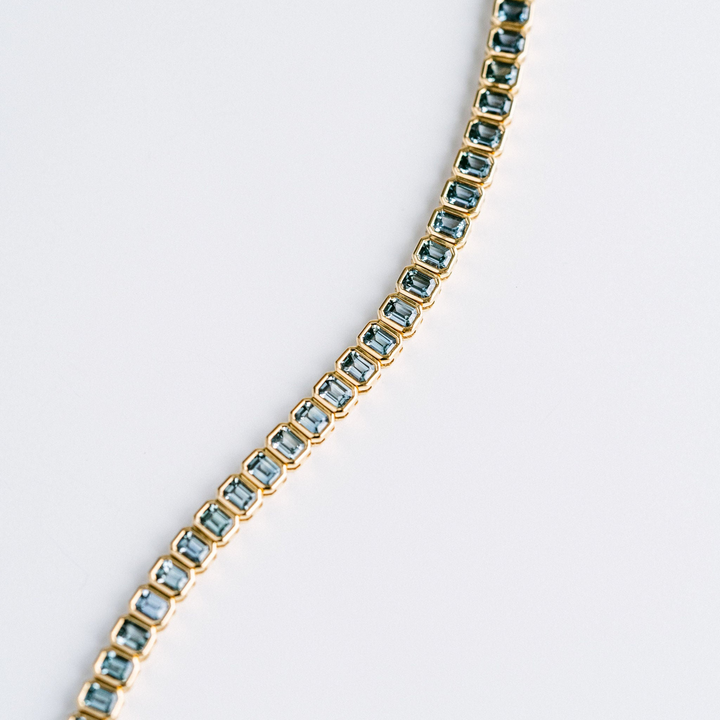 Emerald Cut Blue-Green Sapphire Bezel Tennis Bracelet