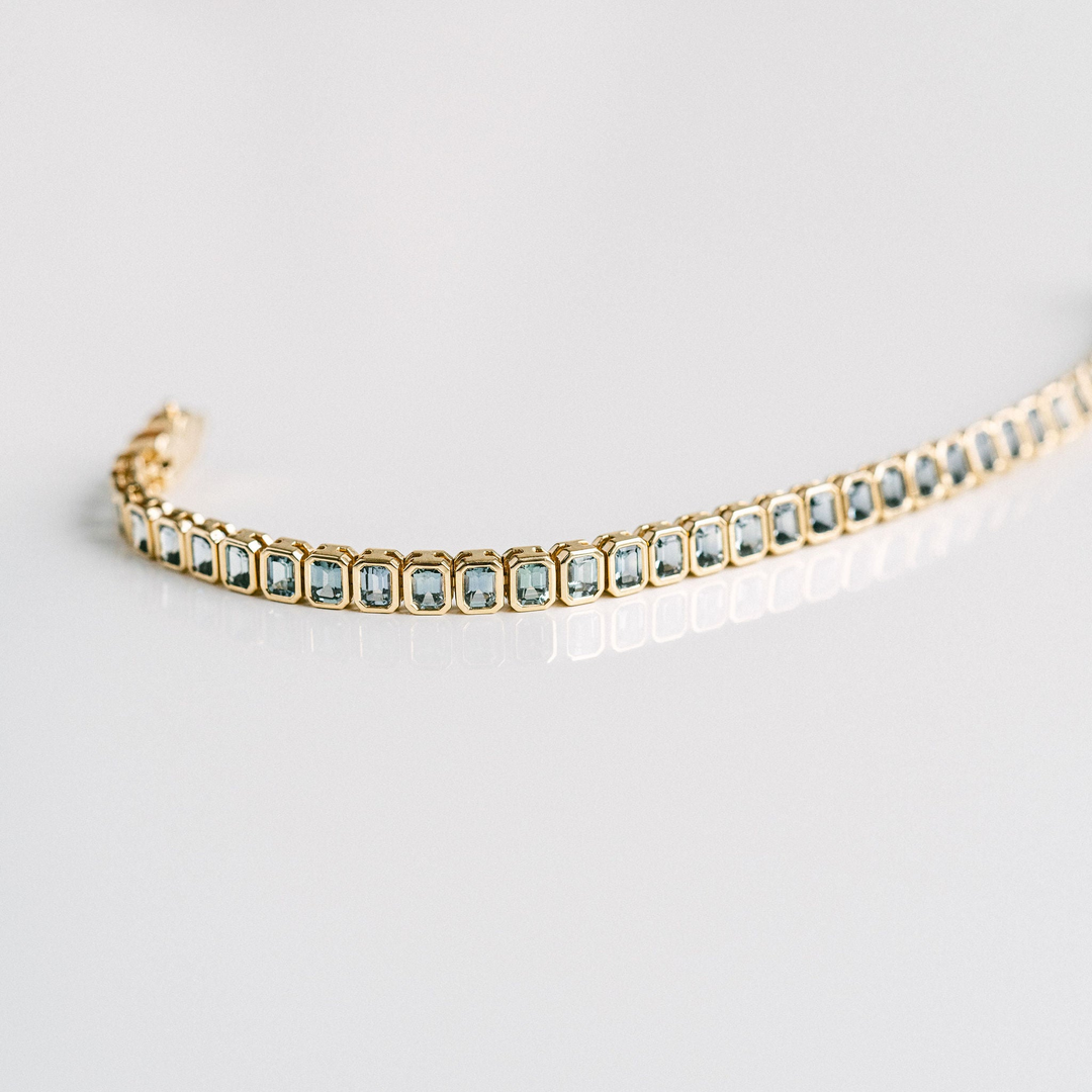 Emerald Cut Blue-Green Sapphire Bezel Tennis Bracelet