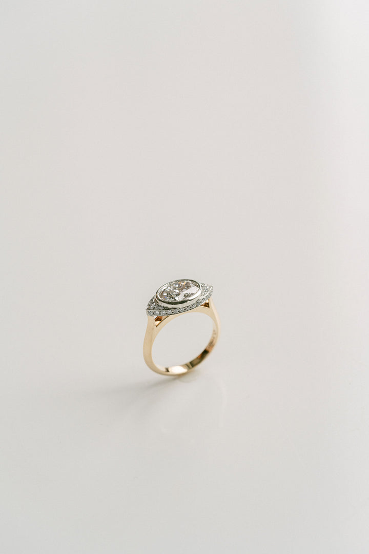 Cavalier Fine Jewelry - Oval Diamond Two Tone Ring With Diamond Eye Halo