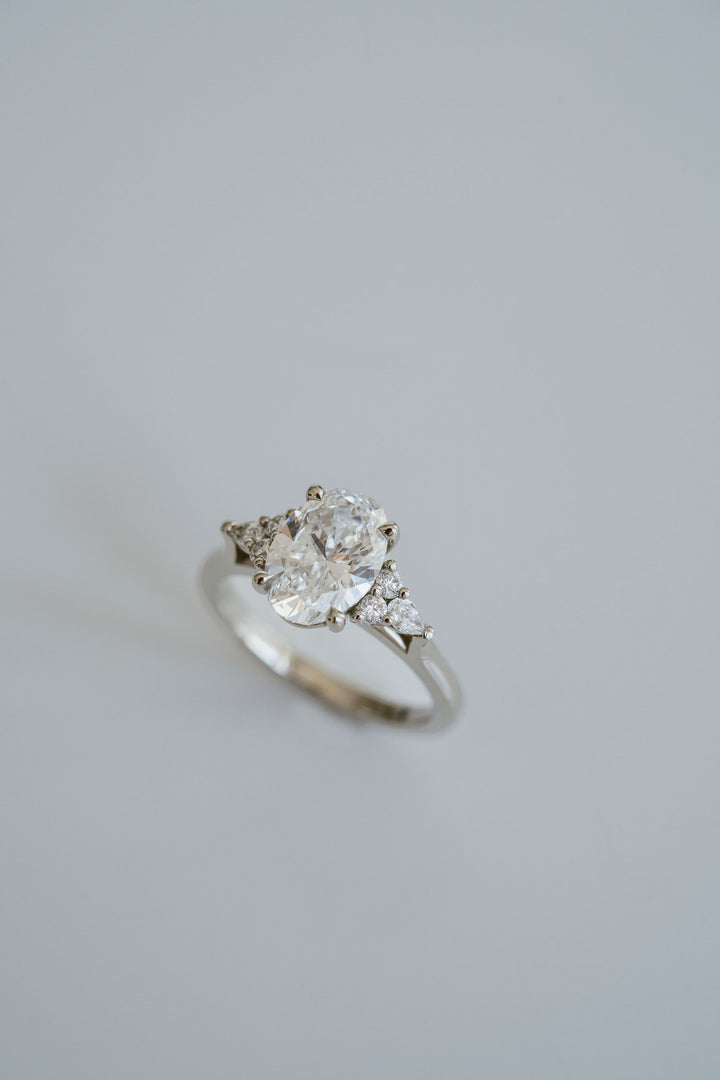 Oval Diamond With Diamond Cluster Accents