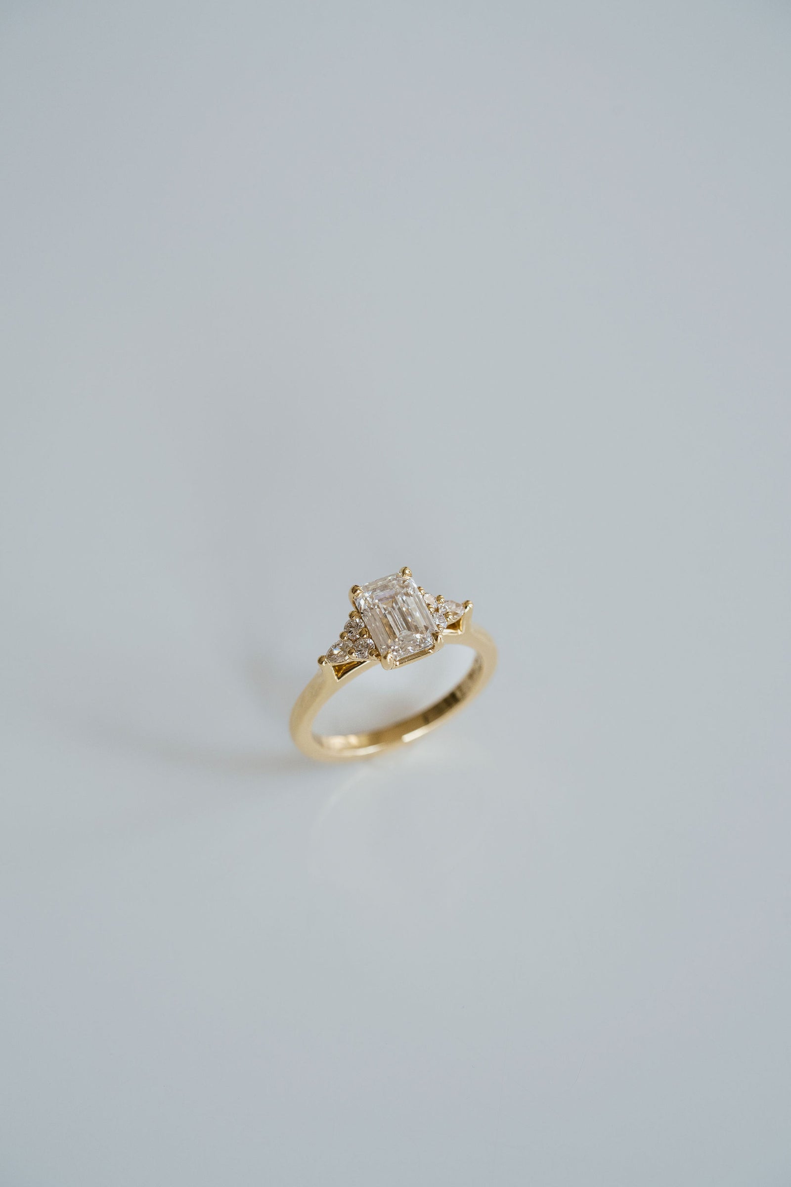 Emerald Cut Diamond With Diamond Cluster Accents