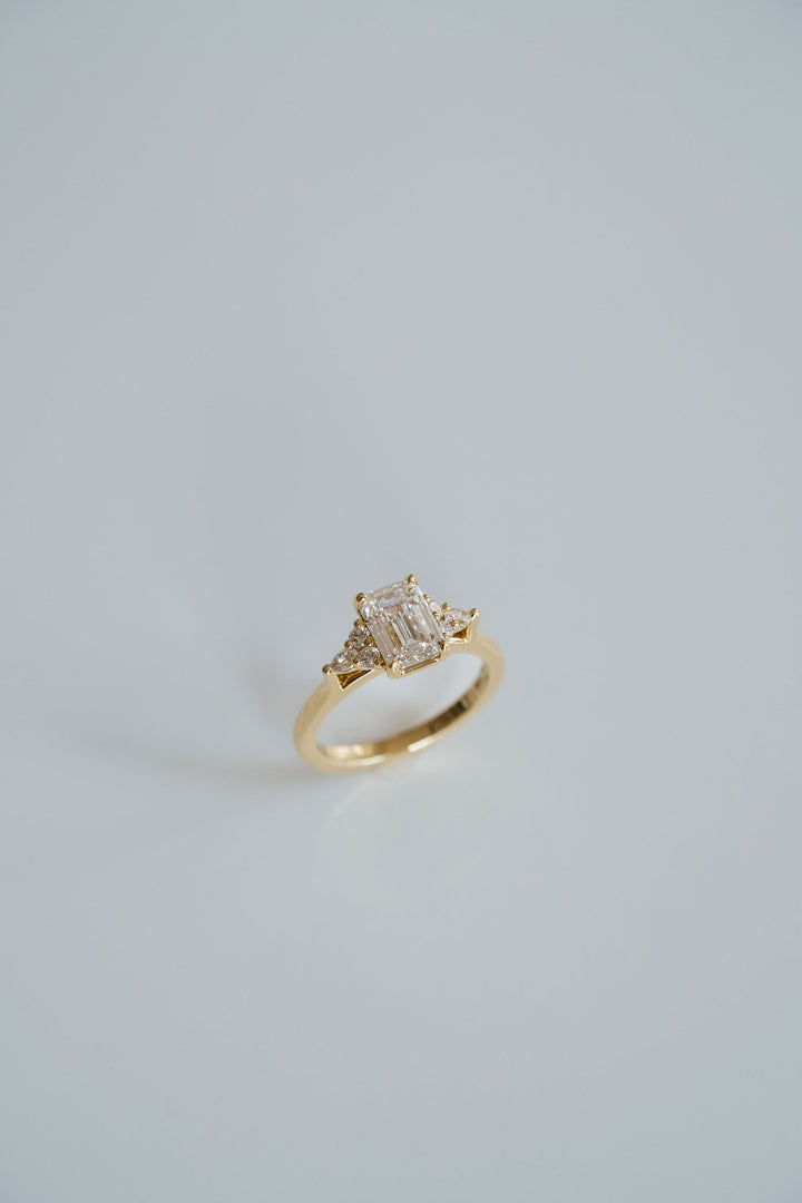 Emerald Cut Diamond With Diamond Cluster Accents