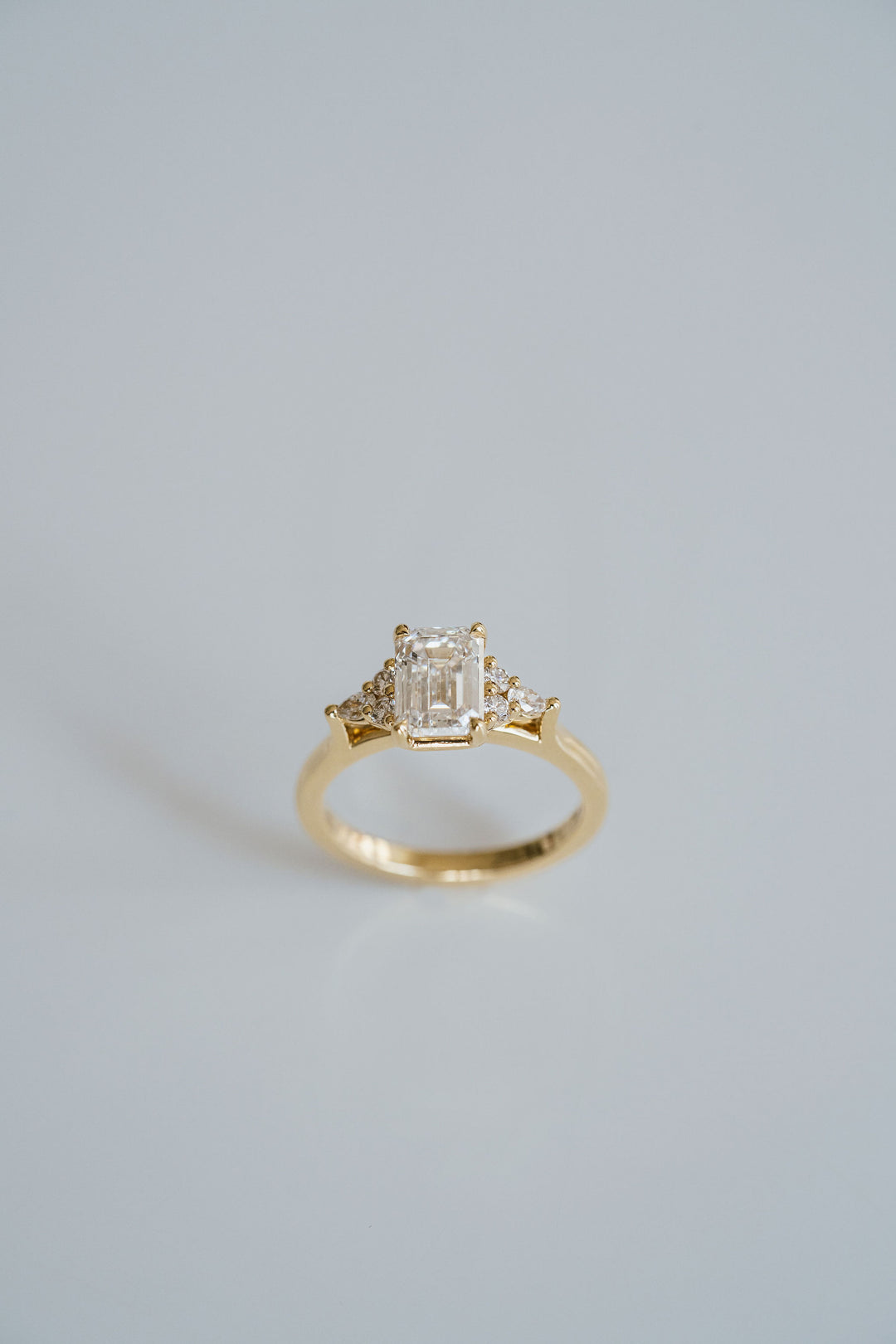 Emerald Cut Diamond With Diamond Cluster Accents