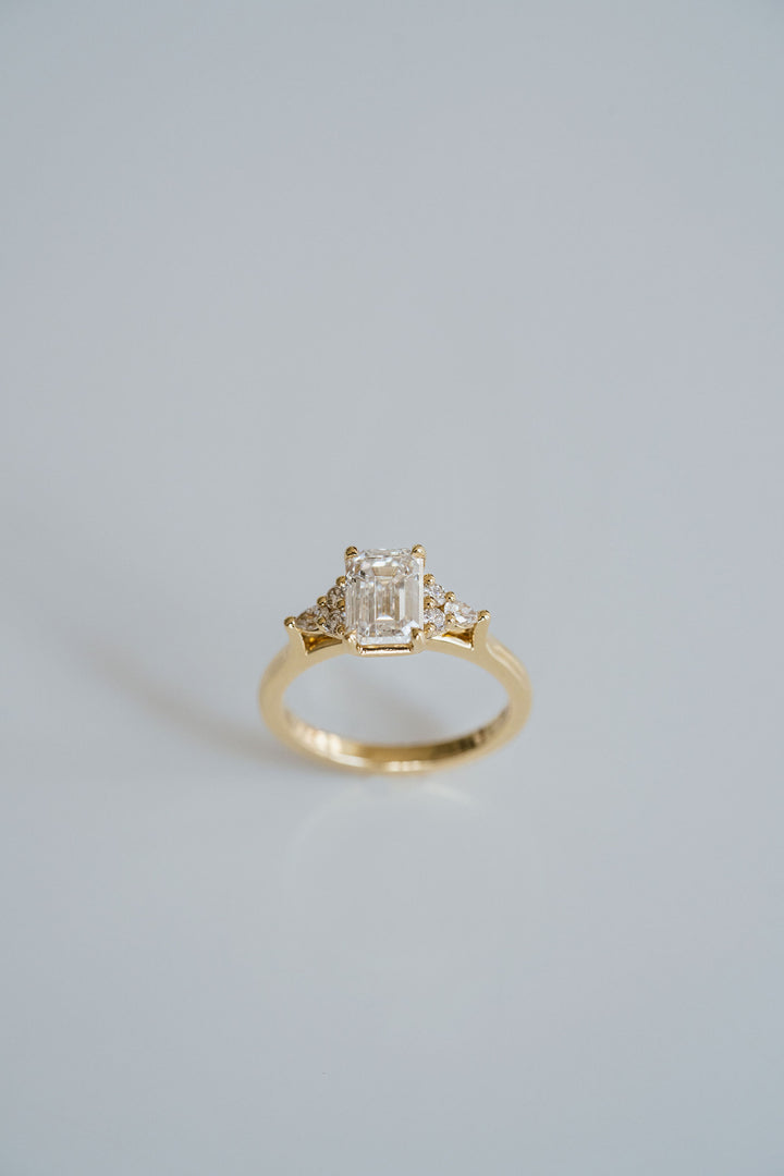 Emerald Cut Diamond With Diamond Cluster Accents