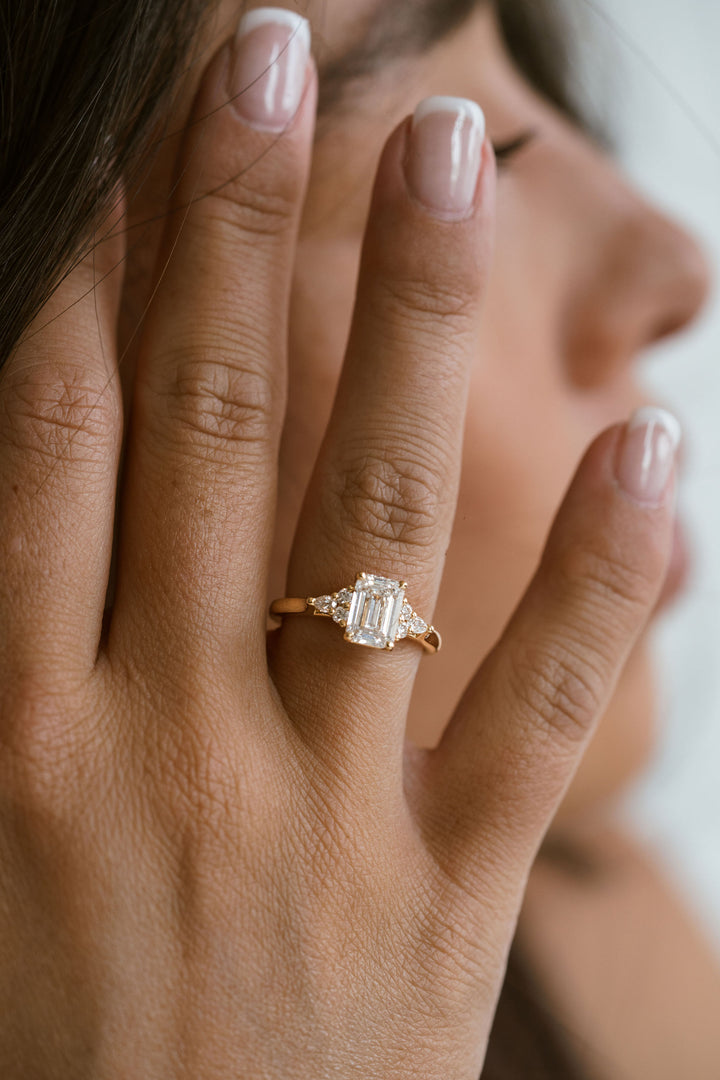 Emerald Cut Diamond With Diamond Cluster Accents
