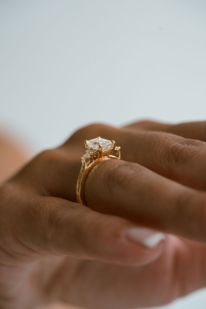 Emerald Cut Diamond With Diamond Cluster Accents