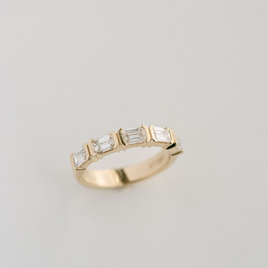 Emerald Cut Diamond East-West Half Bezel Band