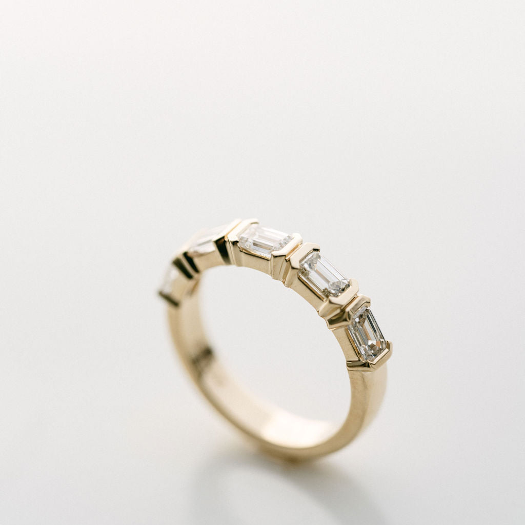 Emerald Cut Diamond East-West Half Bezel Band
