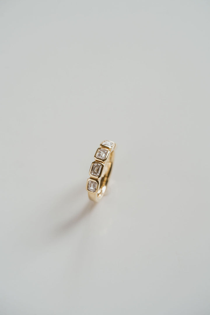 Emerald Cut Diamond East-West Bezel Band
