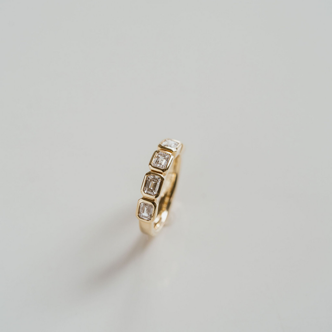 Emerald Cut Diamond East-West Bezel Band