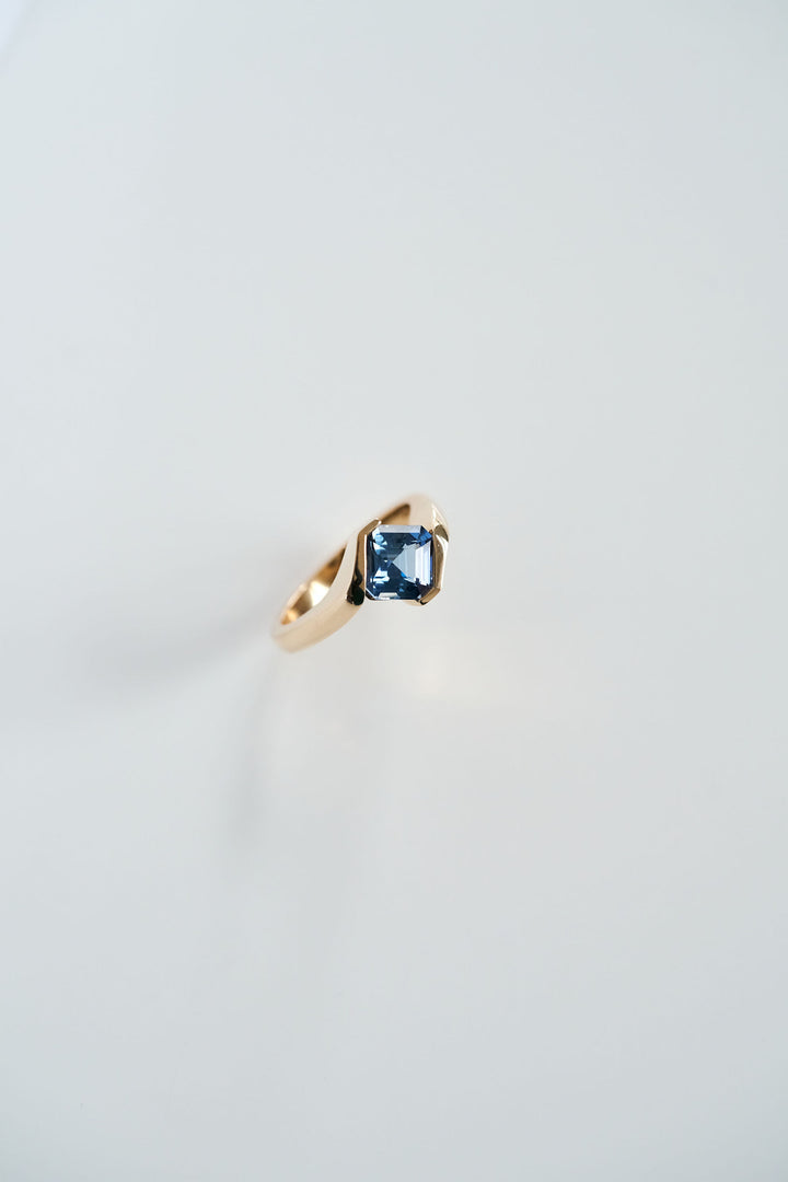 Half Bezel Cushion Cut Sapphire Bypass Ring
