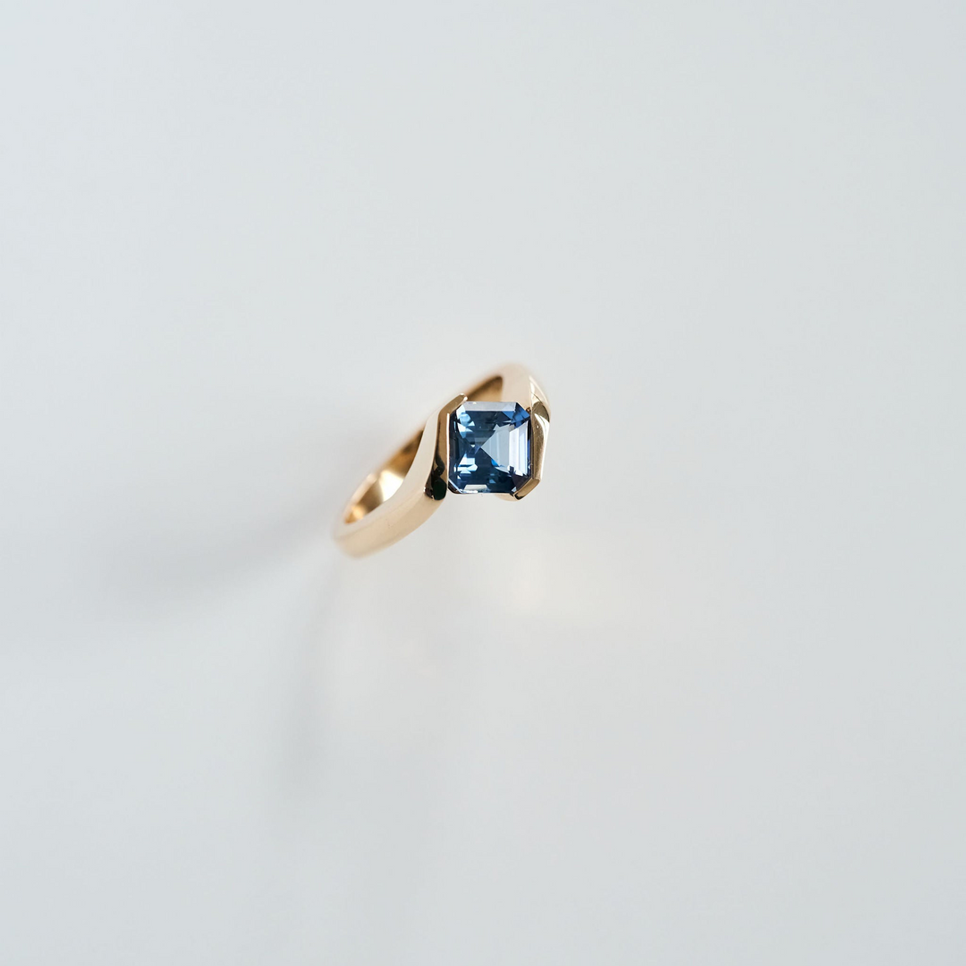 Half Bezel Cushion Cut Sapphire Bypass Ring