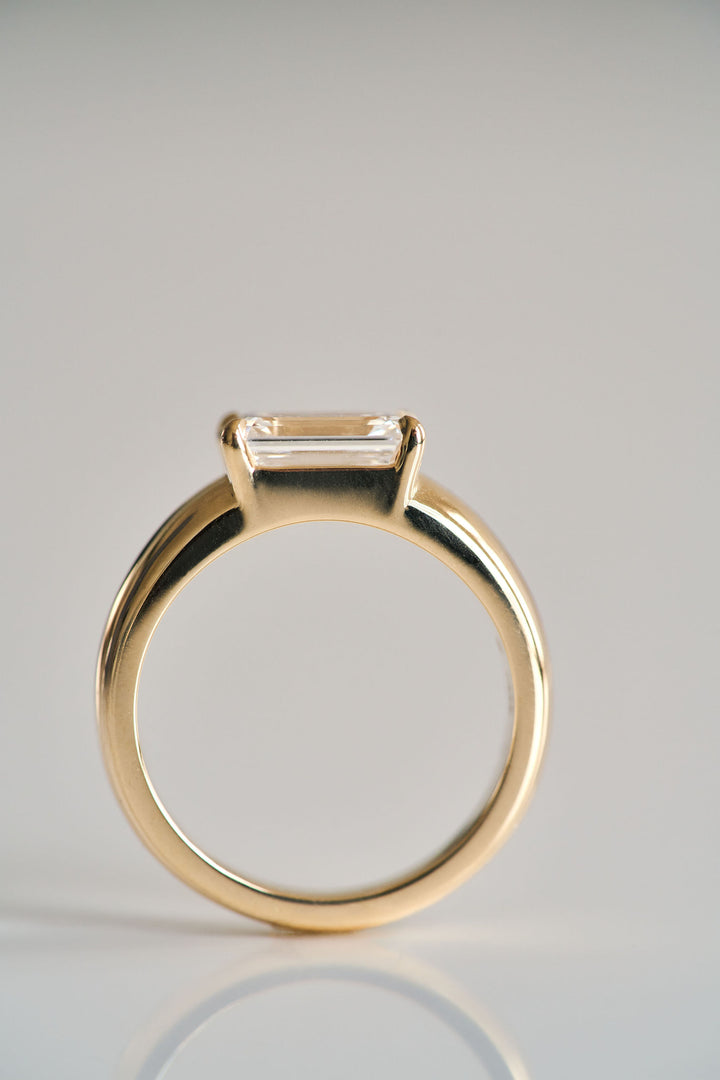 Low Set Emerald Cut Arc Ring