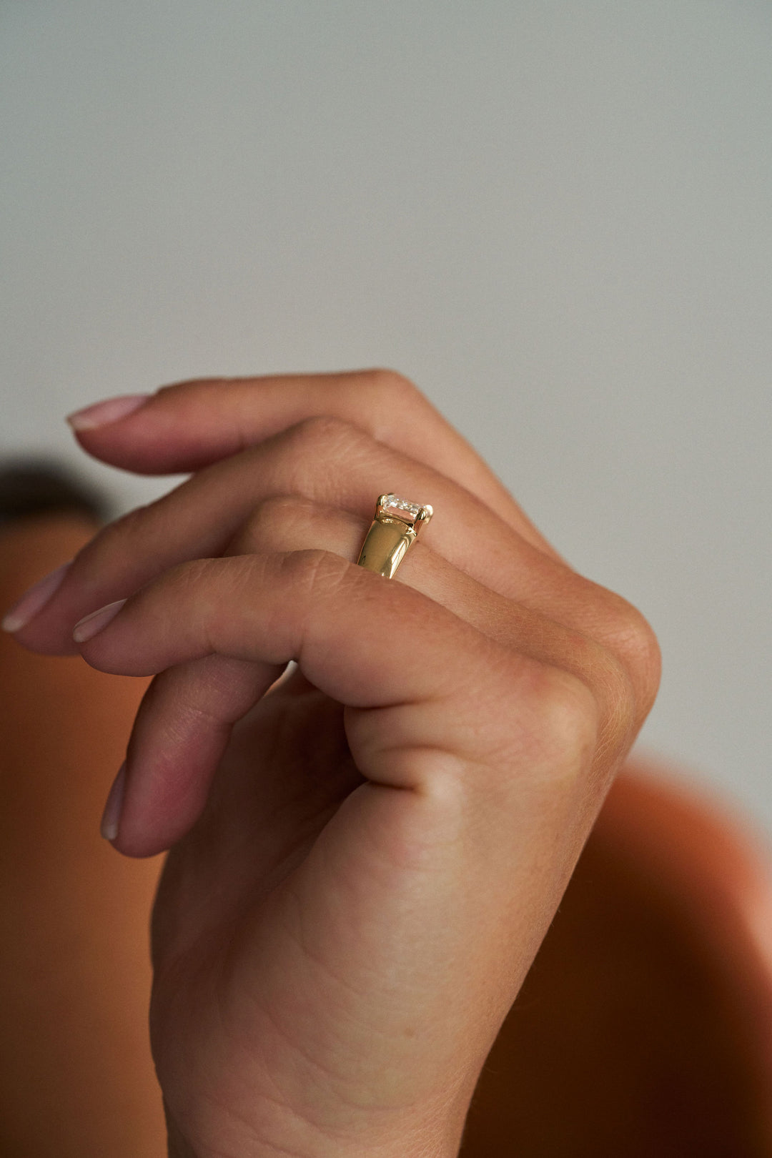 Low Set Emerald Cut Arc Ring