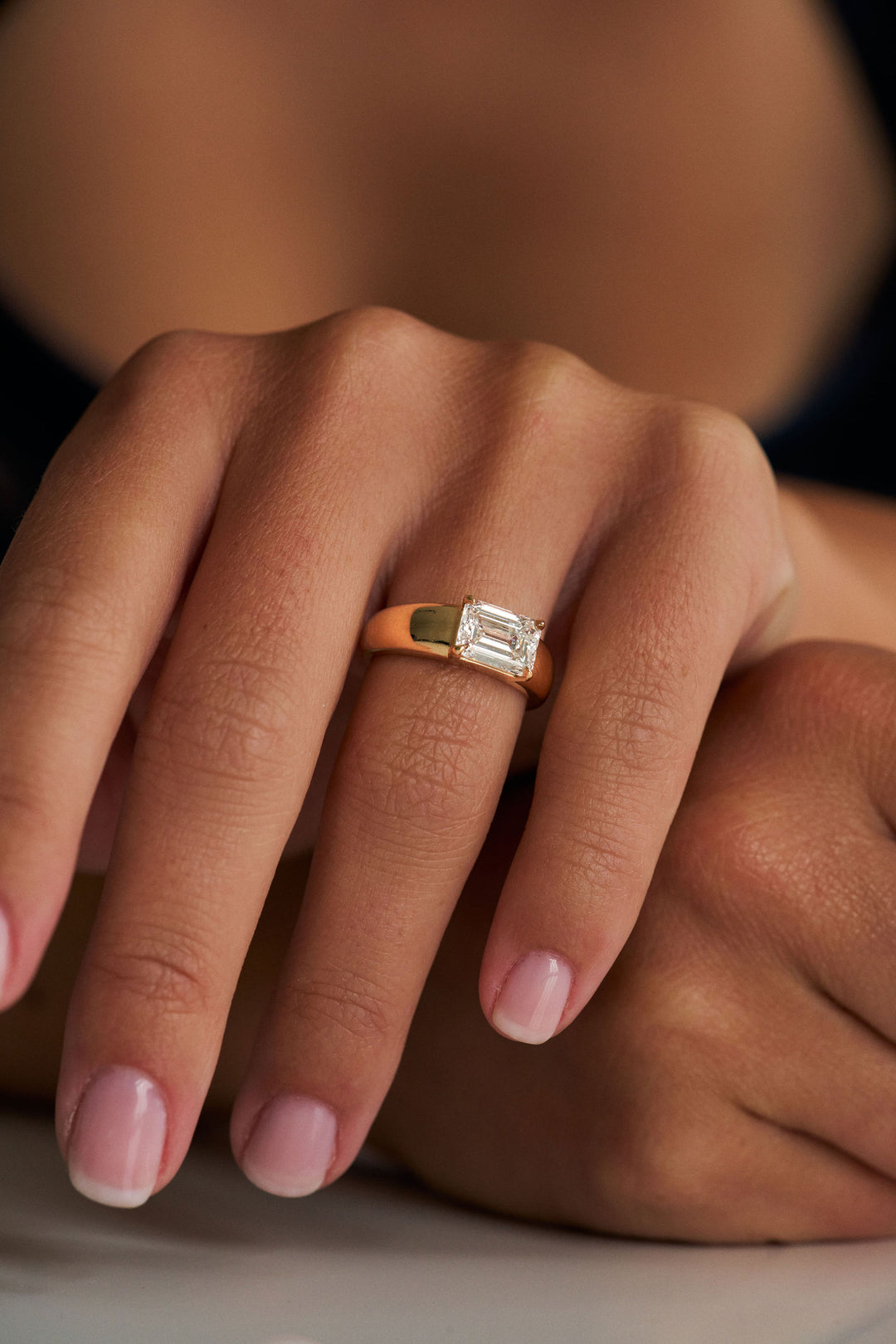 Low Set Emerald Cut Arc Ring