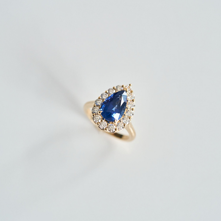 Pear Shape Blue Sapphire with Scalloped Diamond Halo