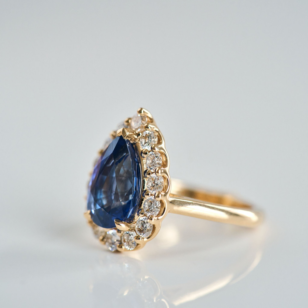 Pear Shape Blue Sapphire with Scalloped Diamond Halo