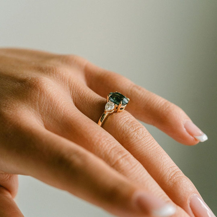Oval Blue-Green Sapphire With Pear Shape Diamond Accents
