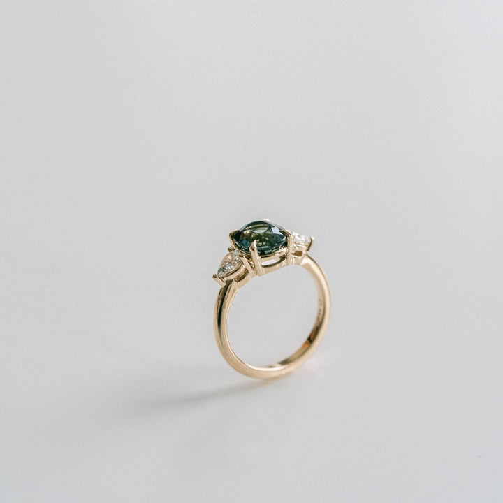 Oval Blue-Green Sapphire With Pear Shape Diamond Accents