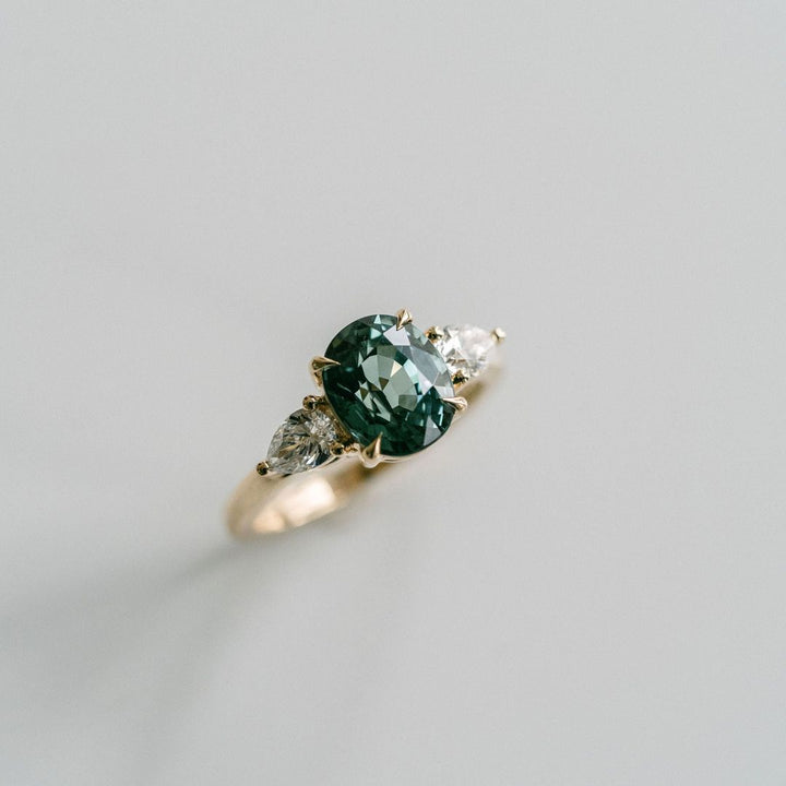 Oval Blue-Green Sapphire With Pear Shape Diamond Accents