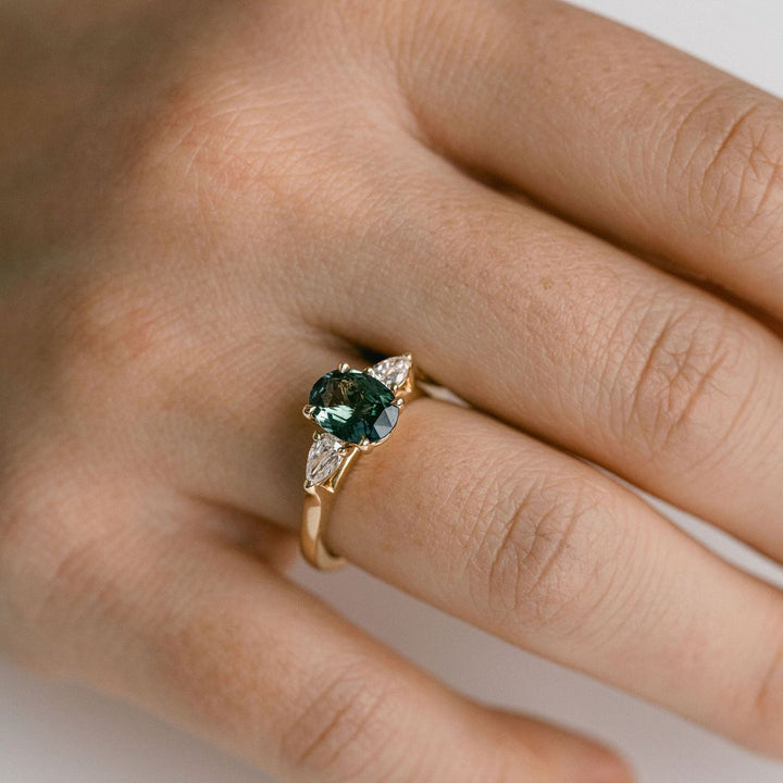 Oval Blue-Green Sapphire With Pear Shape Diamond Accents