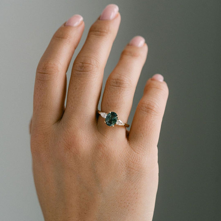 Oval Blue-Green Sapphire With Pear Shape Diamond Accents