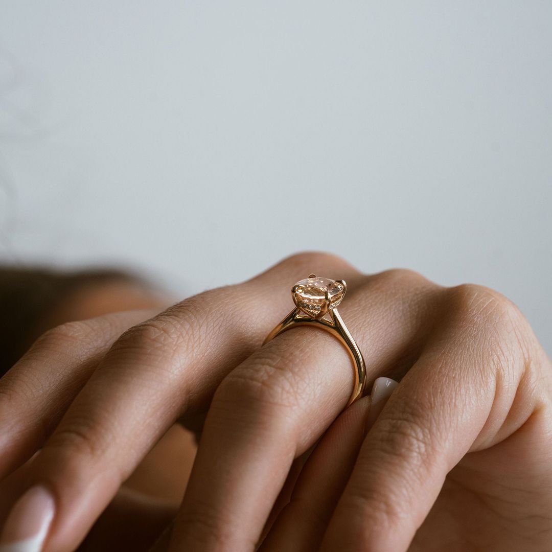 Oval Peach Sapphire Dominion With Diamond Collar