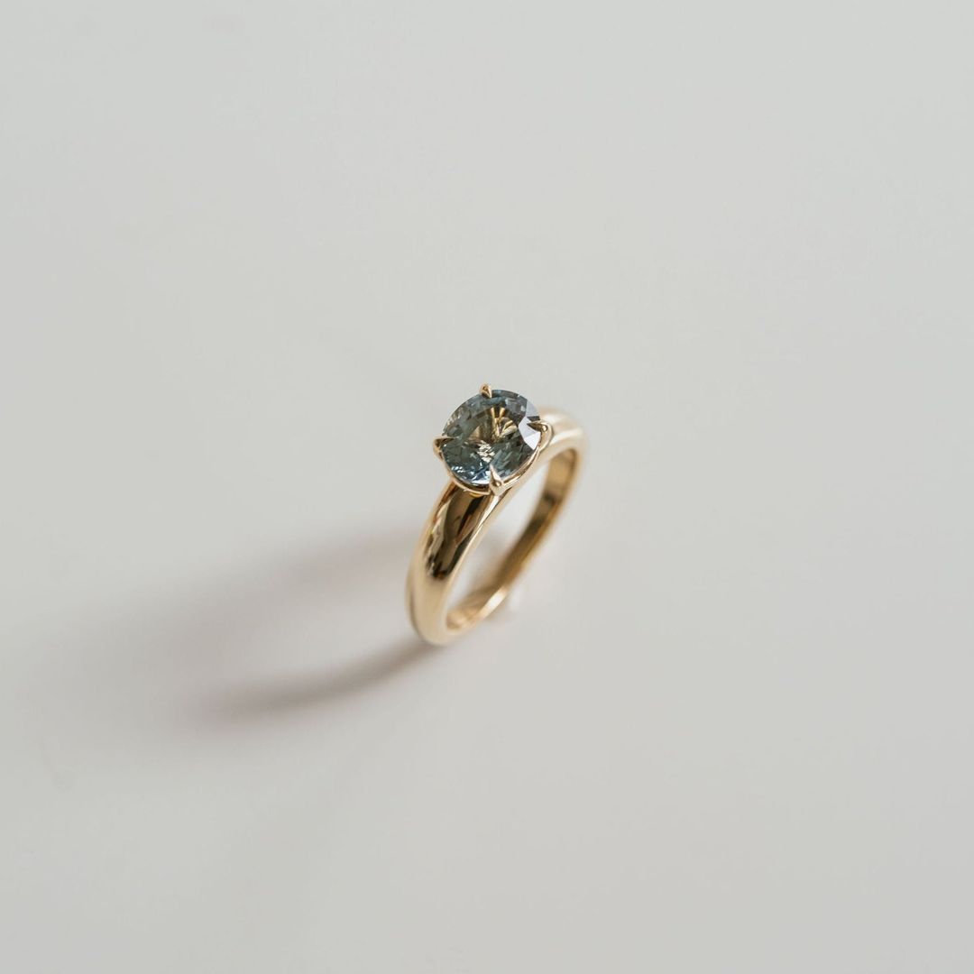 Oval Teal Sapphire East-West Arc Ring