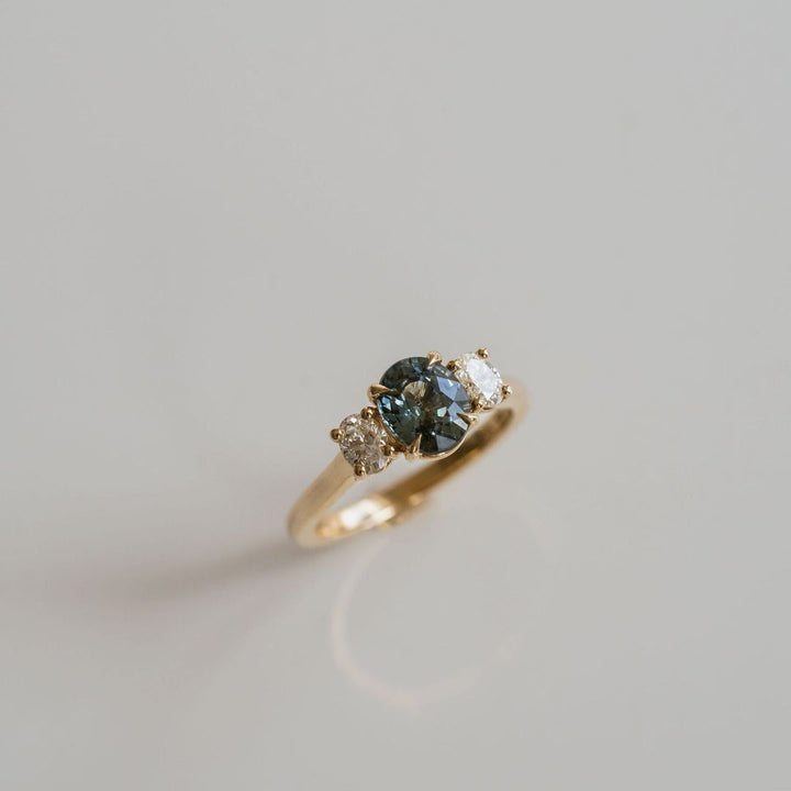 Oval Teal Sapphire With Oval Diamond Accents