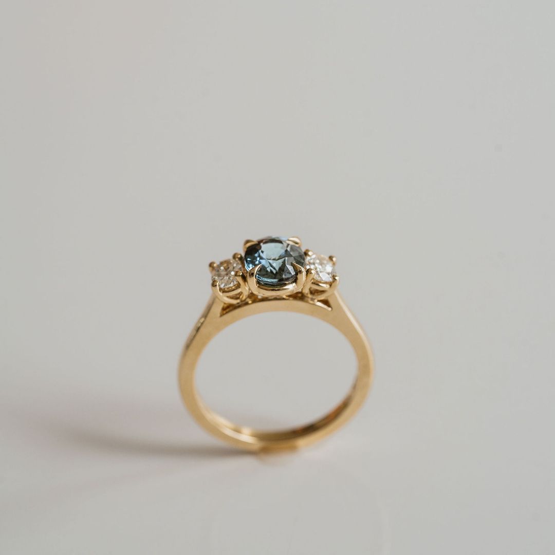 Oval Teal Sapphire With Oval Diamond Accents