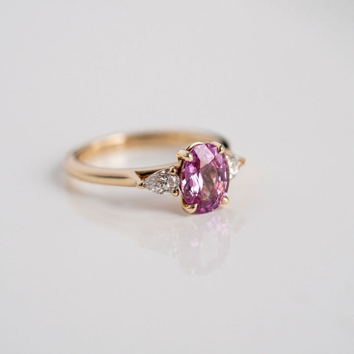 Oval Vivid Pink Sapphire With Pear Shape Diamond Accents